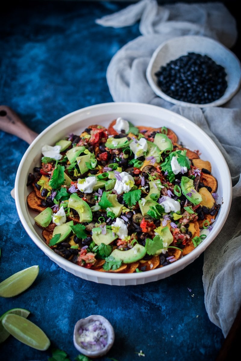 vegan sweet potato nachos in a serving platter
