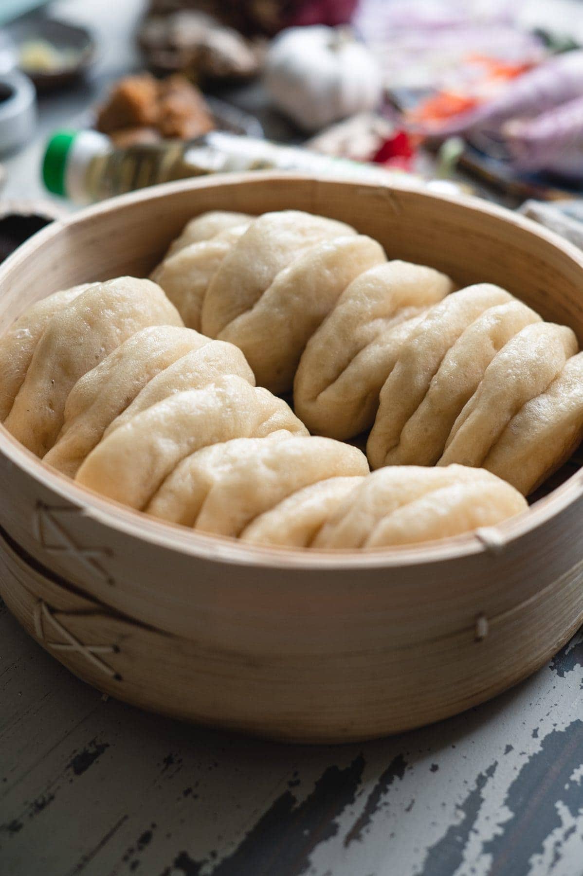 close up of vegan steamed bao buns in a steamer basket