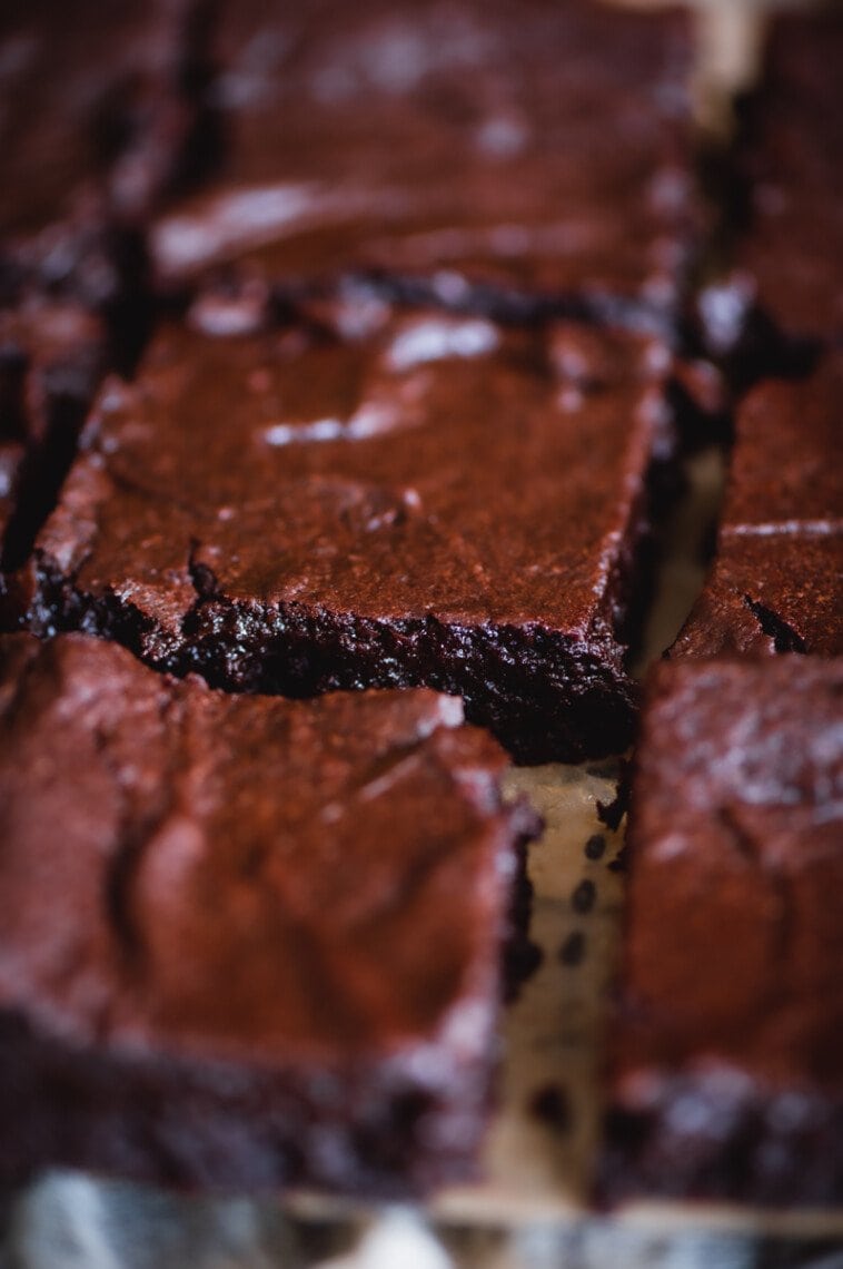 Closeup view of the side and top of a vegan brownie