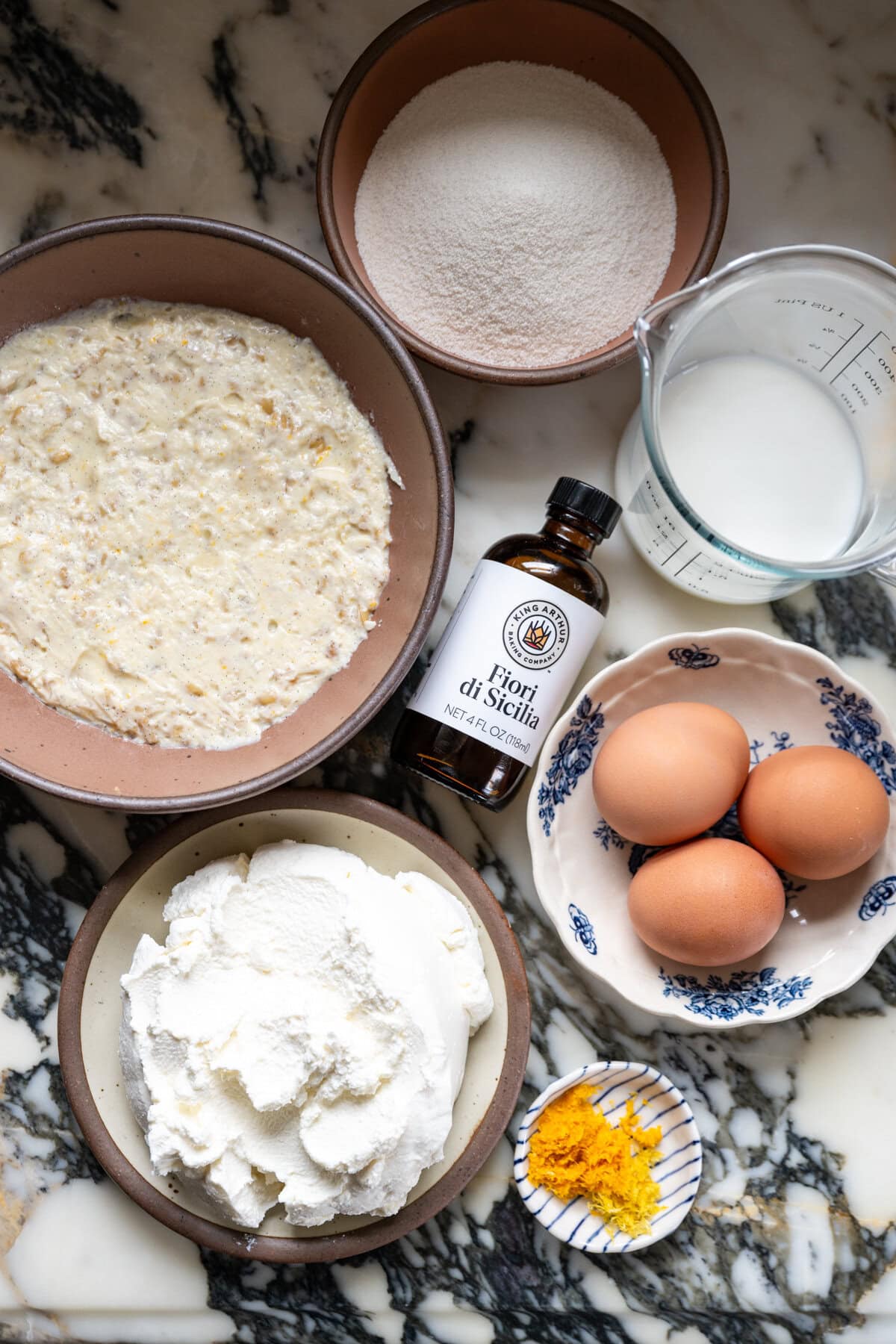 Ricotta, eggs, sugar, milk, orange and lemon zest, and Fiori di Sicilia extract for Pastiera Napoletana filling
