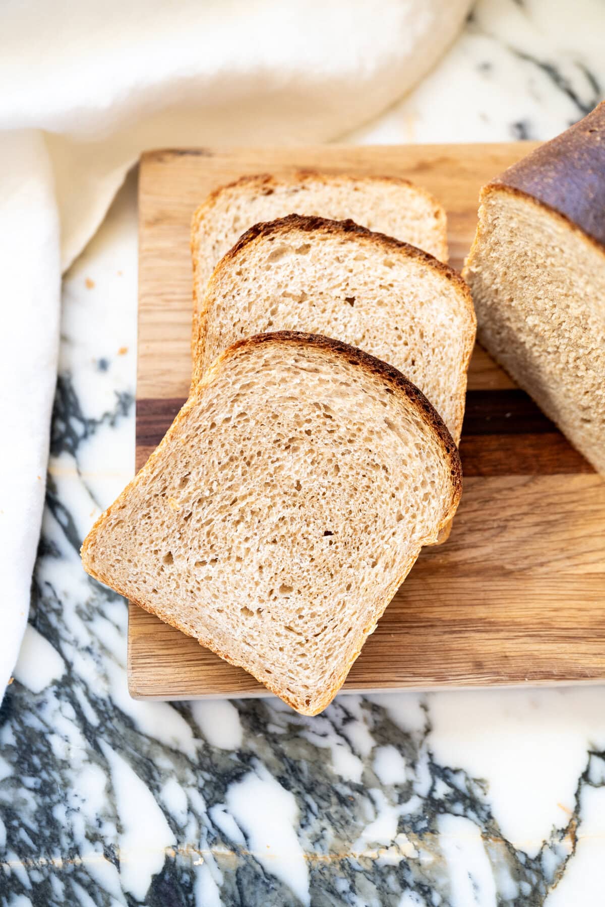 Sliced whole wheat sourdough sandwich bread with soft crumb